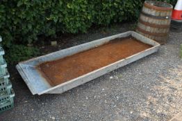 A long metal trough approx. 84