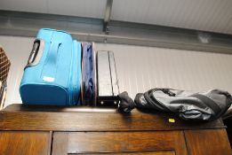 A briefcase, suitcase and various bags