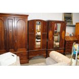 A 1930's oak mirrored door wardrobe