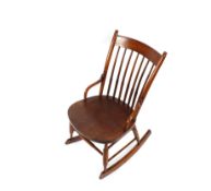 A bentwood stick back rocking chair
