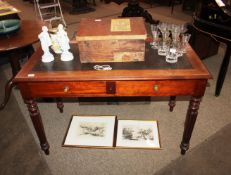 A 19th Century mahogany two drawer writing table, the leather inset top above two frieze drawers,