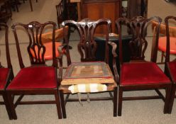 A set of six carved mahogany Chippendale style dining chairs, having pierced splat backs,