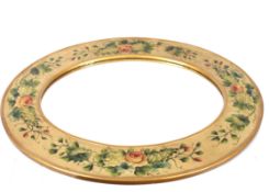 A decorative floral painted oval wall mirror, 90cm x 77cm overall