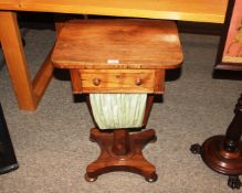 A 19th Century rosewood sewing table, having rectangular top above single drawer and silks well,