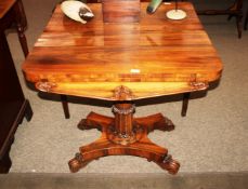 A Victorian walnut fold over card table, raised on tapering fluted central column and quatrefoil
