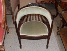 An Edwardian mahogany framed tub shaped salon chai