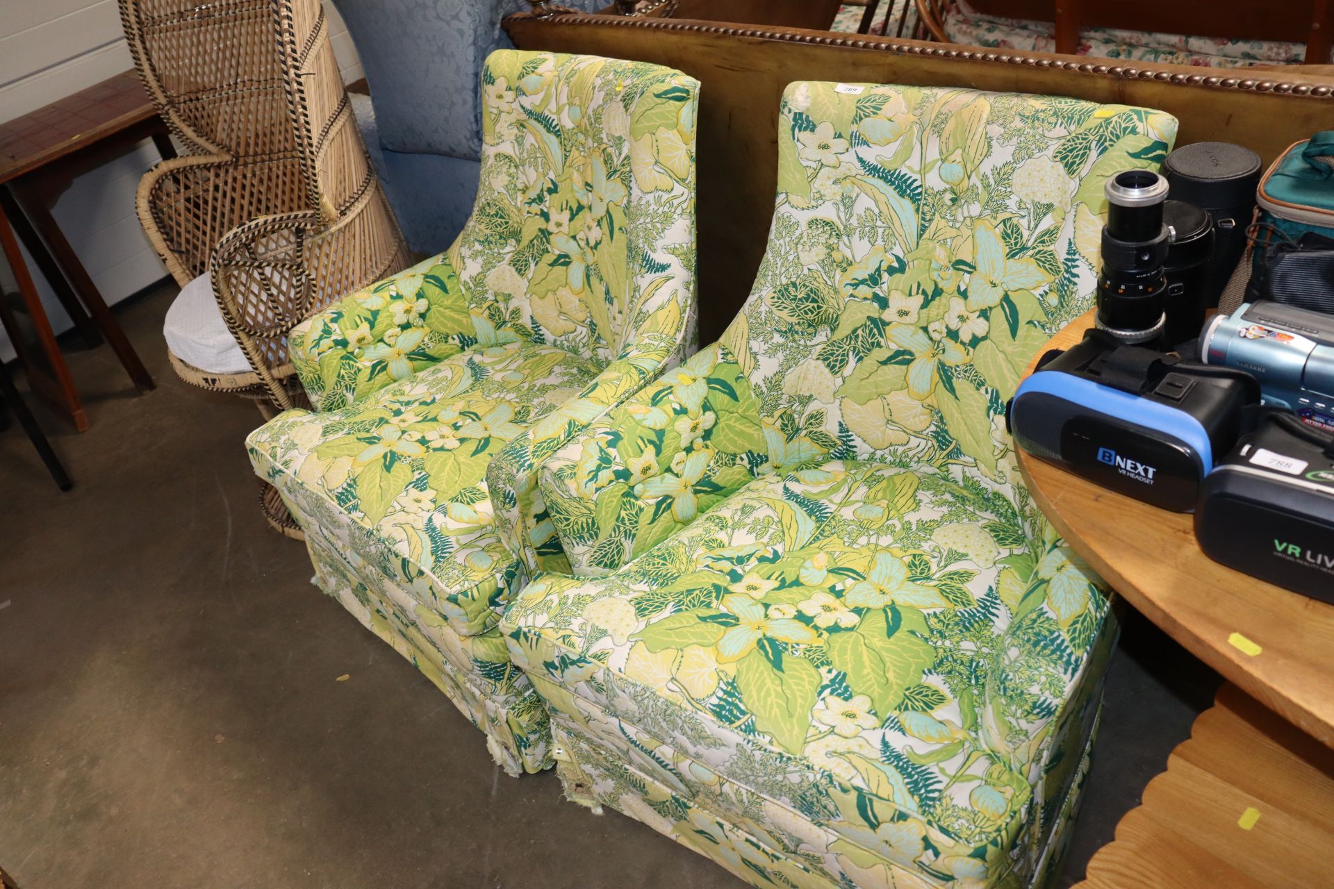 A pair of floral upholstered button back chairs