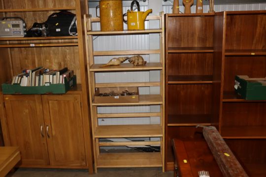 A modern beech folding shelf unit