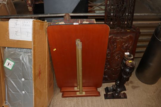 A metal framed table and two storage crates