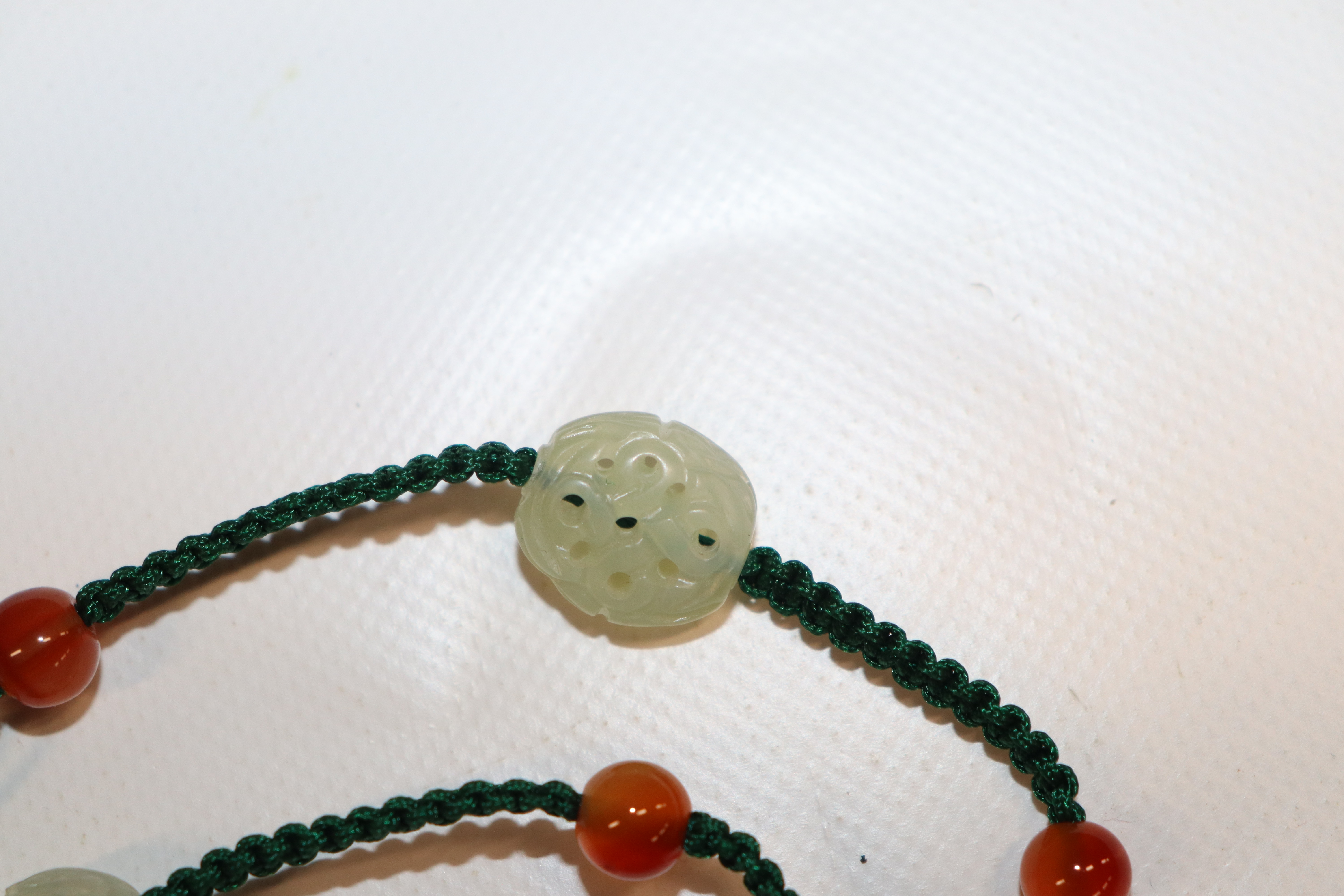 A Chinese jade Buddha necklace; a black jade and c - Image 5 of 13