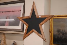 A driftwood style star shaped blackboard