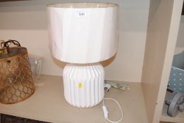 A white pottery table lamp of fluted design, compl