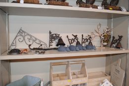 A brass mask door knocker; four cast iron door bel