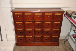 A nest of mahogany Chemist drawers, each of the tw