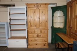 A stripped pine linen cupboard, the upper section