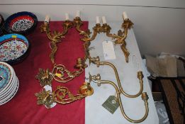 Three gilded Rococo twin branch wall lights; a pai