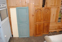 A collection of various pine doors and panels