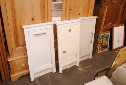A cream painted and faux marble door and drawer panel,