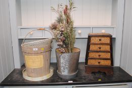 A wine bucket with swing handle; an Adept wicker s