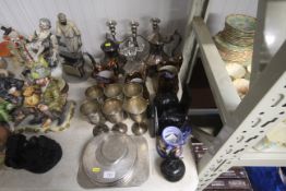 A collection of metalware including candelabra, go