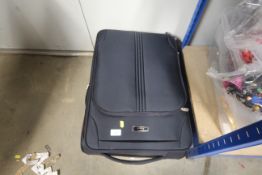 A IT luggage suitcase and contents of linen
