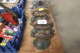 A pair of cast iron door stops in the form of bask