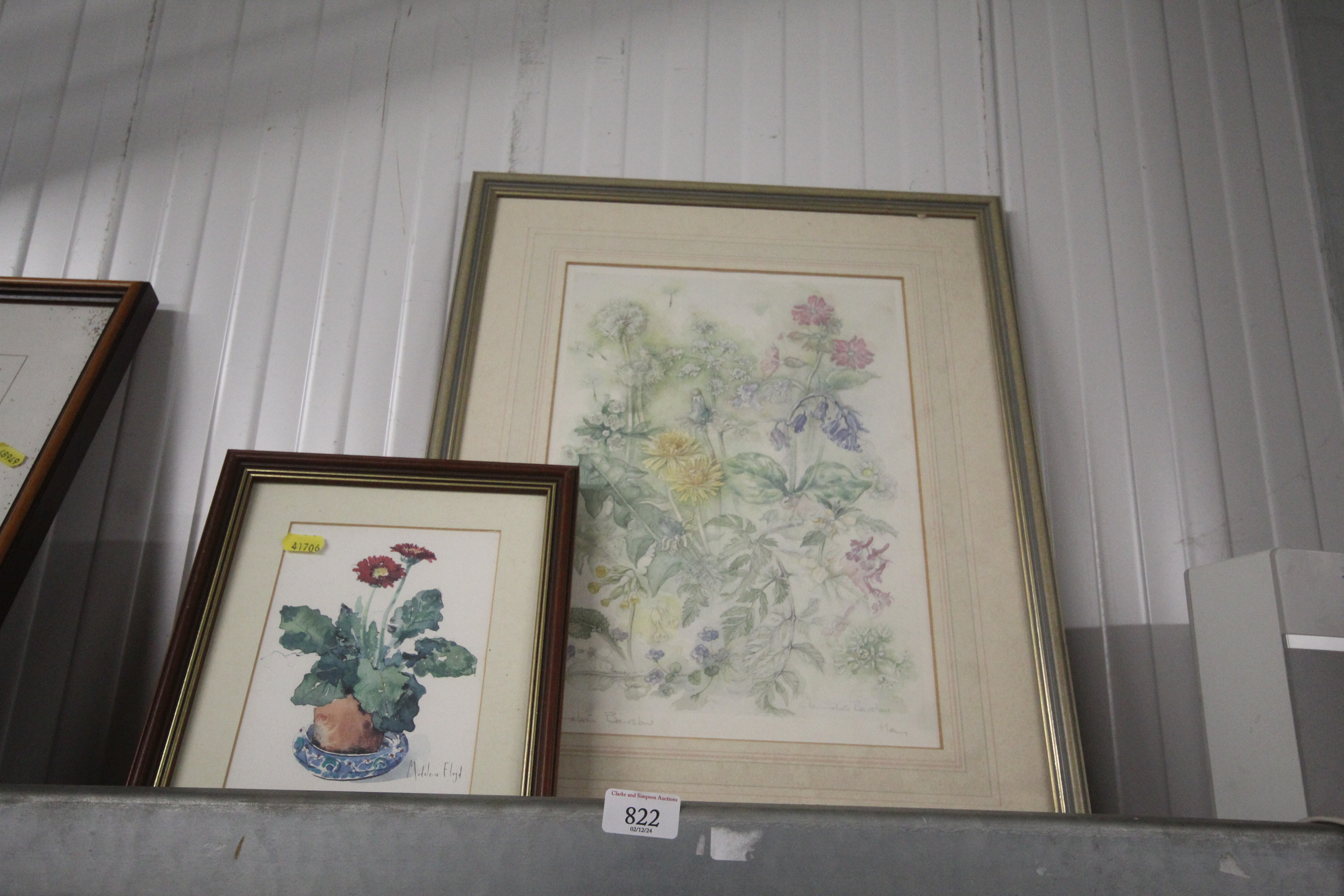 A still life print of flowers and a pencil sign st