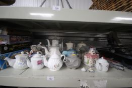 A collection of novelty and other tea pots
