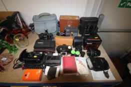 A Cannon A1 camera, various other cameras, binocul