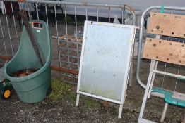 A metal folding snap on A frame board.