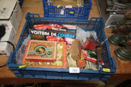 A box of vintage toys including tin plate racing c