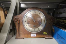 An oak cased three hole mantle clock
