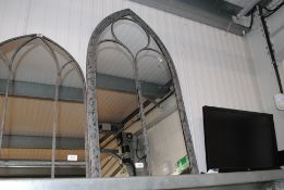 A metal arch framed mirror (69)