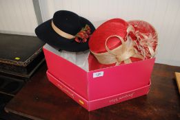 A hat box containing two hats