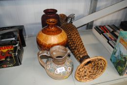 Two pottery vases, a metal and wicker vase and a p