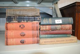 A collection of various books to include The Trium