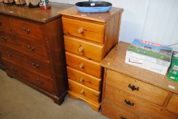 A narrow pine chest fitted five drawers