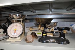 Three sets of scales and a collection of weights