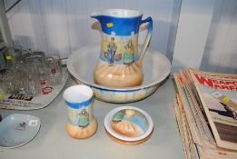 A wash jug and bowl, toothbrush holder and soap di