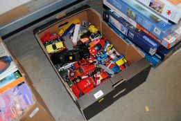 A box of various die cast and other model vehicles