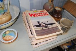 A collection of weapons and warfare magazines