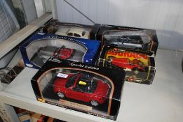 A collection of Burago and other boxed die cast model vehicles to include special editions