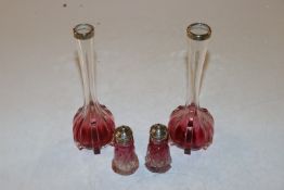 A pair of silver collared amethyst coloured bottle