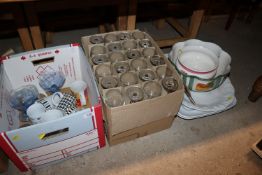 A box containing various wine glasses, various sun