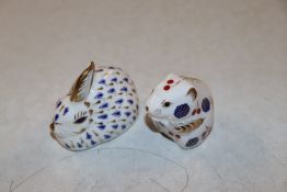 A Royal Crown Derby paperweight in the form of a r