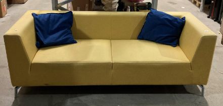 Yellow upholstered low-back three-seater settee on chrome legs (saleroom location: LO1)