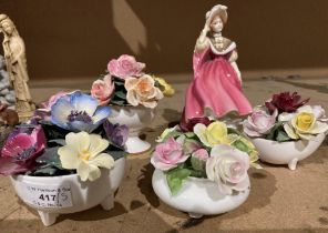 A Royal Doulton bone china figurine 'Sunday Morning' HN2184 and four bone china floral displays in