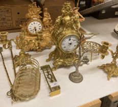 Two gilt coloured continental style mantel clocks, table lamps, pair of small brass candlesticks,