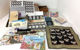 Box containing stamps, pens, National Trust compass in a tin, magnifying glass,