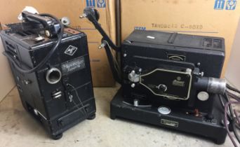 Two movie projectors with boxes (for display,